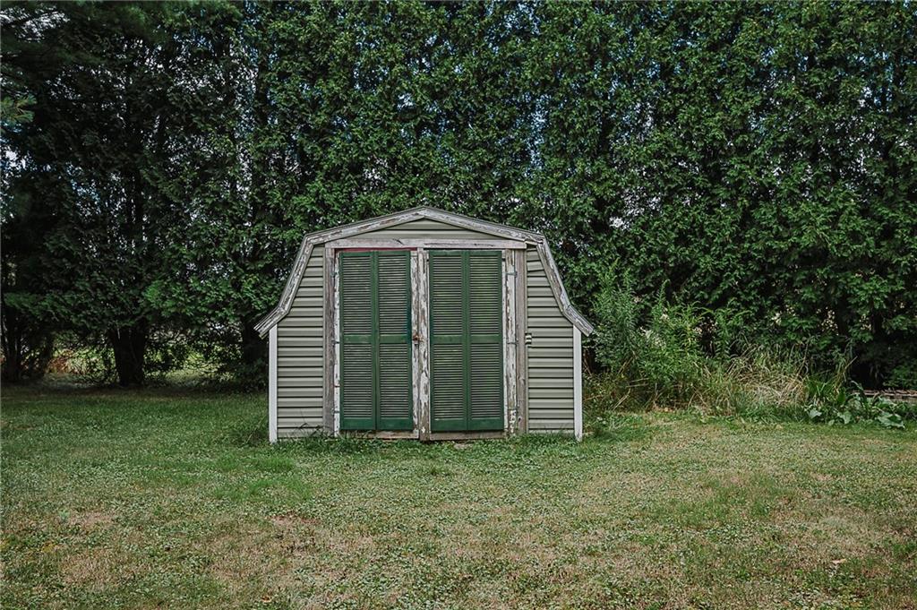 1171 Churchill Road Marion Center, PA 15759 - Photo 24 of 28 a front view of a house with a garden