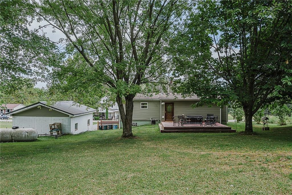 1171 Churchill Road Marion Center, PA 15759 - Photo 27 of 28 a front view of a house with a garden and trees
