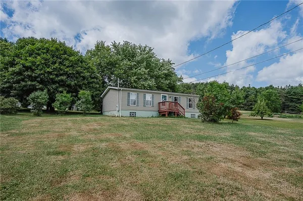 a fire hydrant in the middle of a field