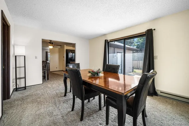 a dining room with furniture and window