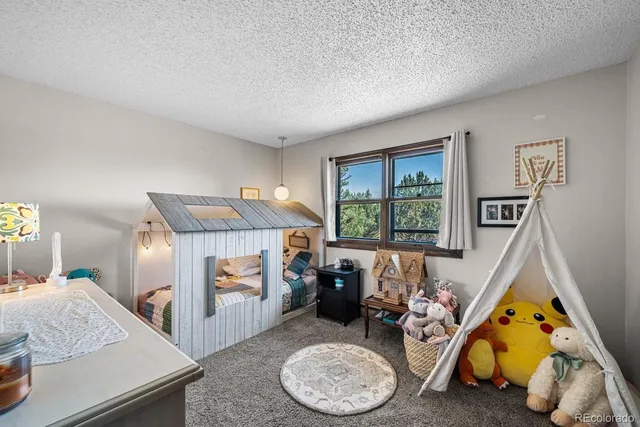 a bedroom with bed and a window