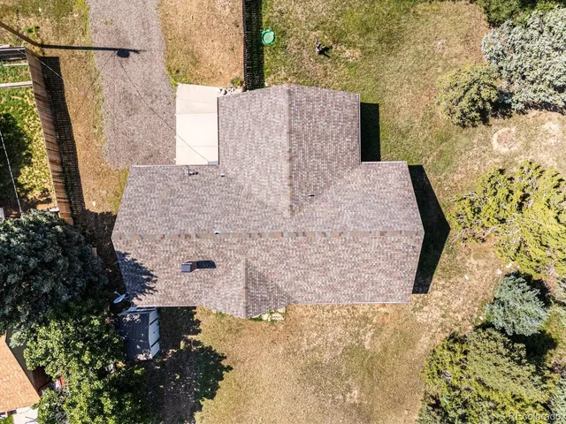 a view of balcony with wooden floor and fence