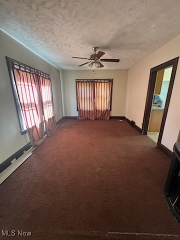 870 Helmsdale Road Cleveland Heights, OH 44112 - Photo 5 of 20 Carpeted spare room featuring a textured ceiling and ceiling fan