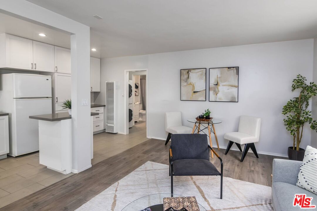 1524 Franklin Street, Unit B Santa Monica, CA 90404 - Photo 2 of 12 a living room with furniture and a refrigerator