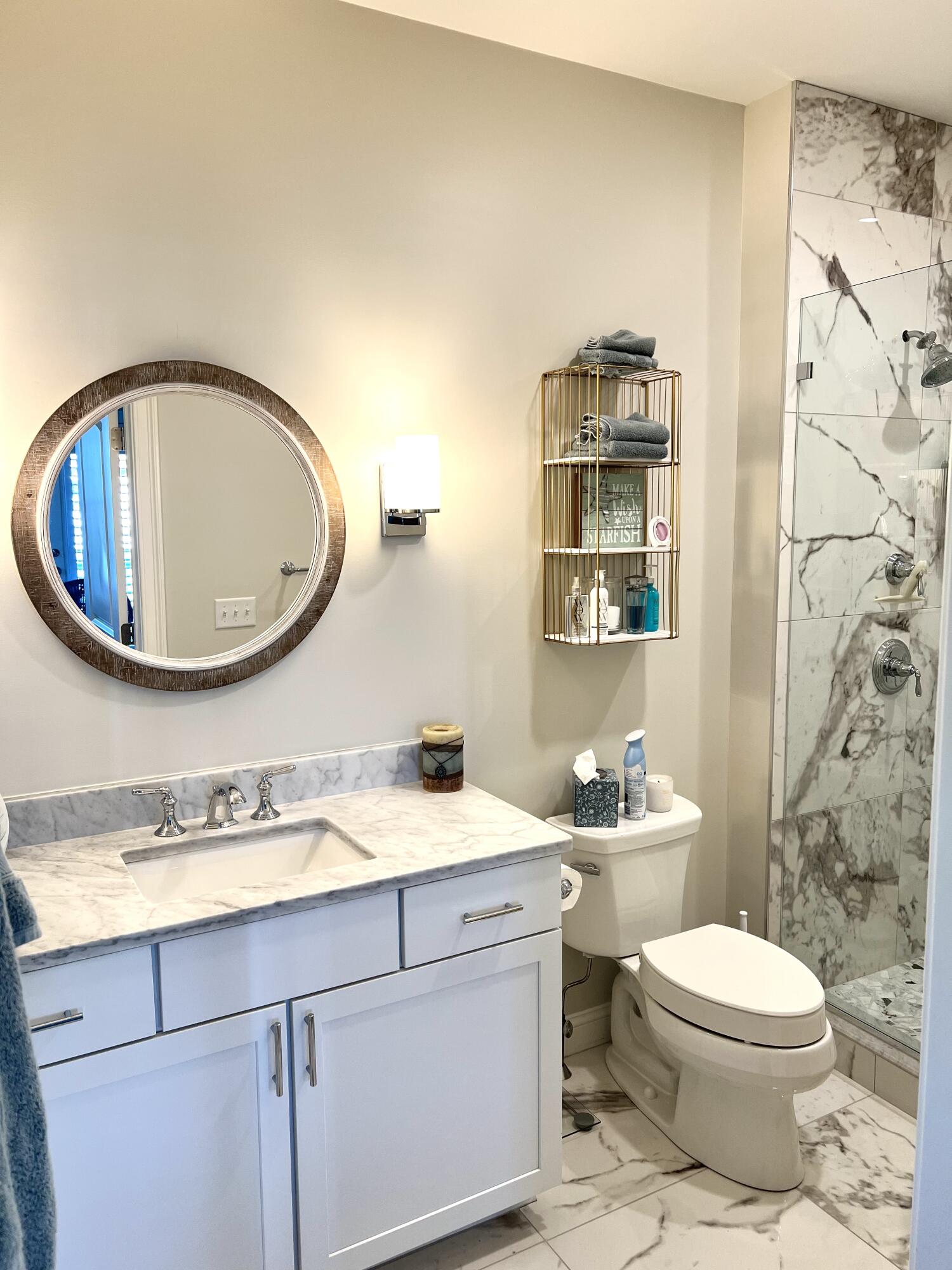 601 Ma Route, Unit 27 Dennis, MA 02638 - Photo 18 of 34 a bathroom with a toilet a sink and mirror