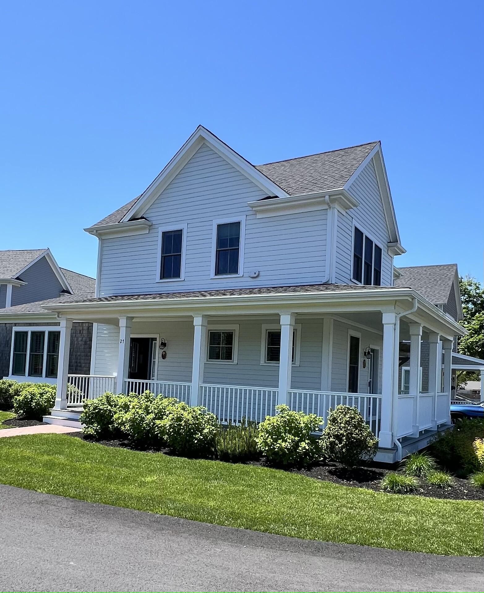 601 Ma Route, Unit 27 Dennis, MA 02638 - Photo 2 of 34 a front view of a house with a yard