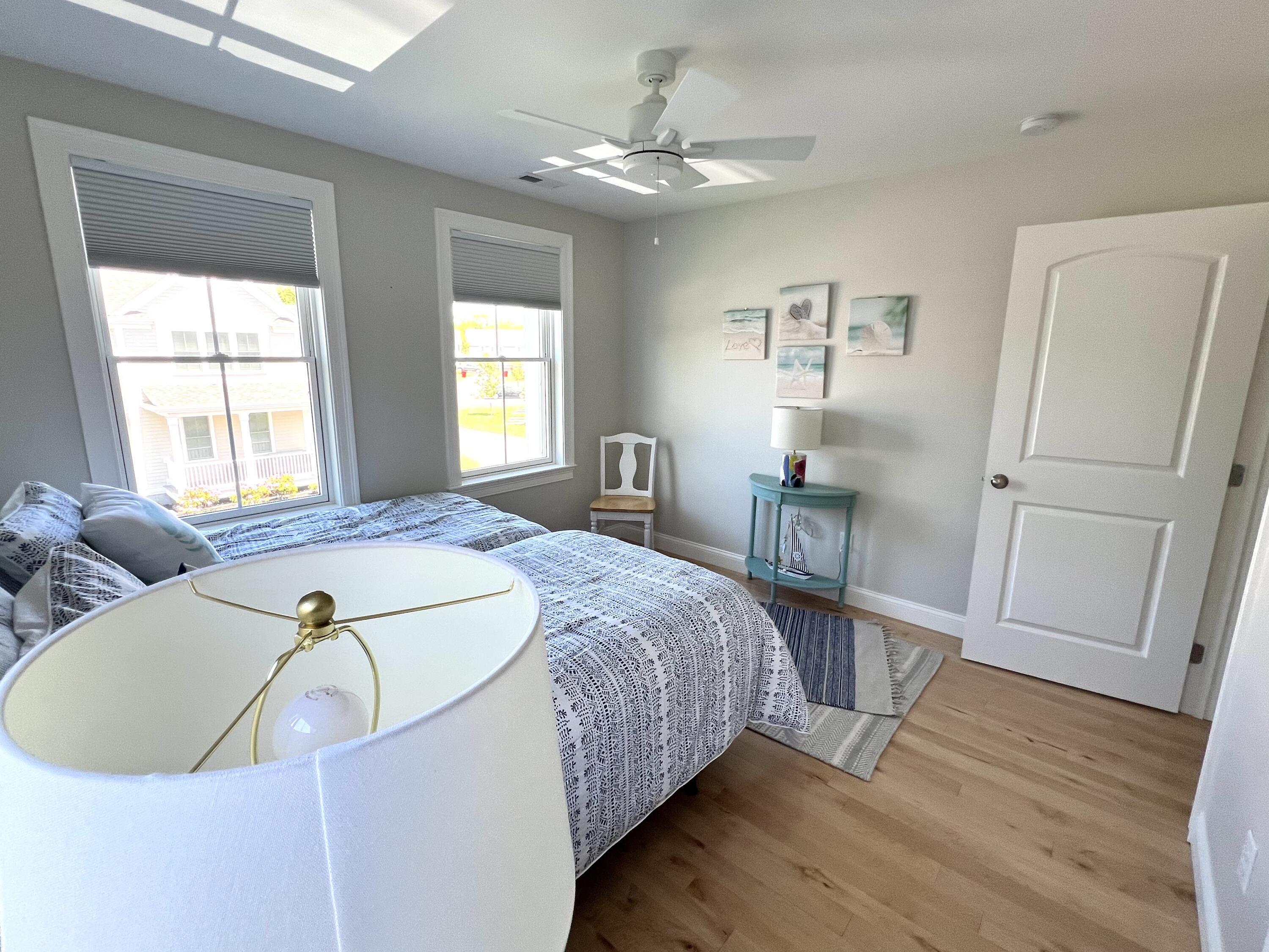 601 Ma Route, Unit 27 Dennis, MA 02638 - Photo 24 of 34 a bed sitting in a bedroom next to a window