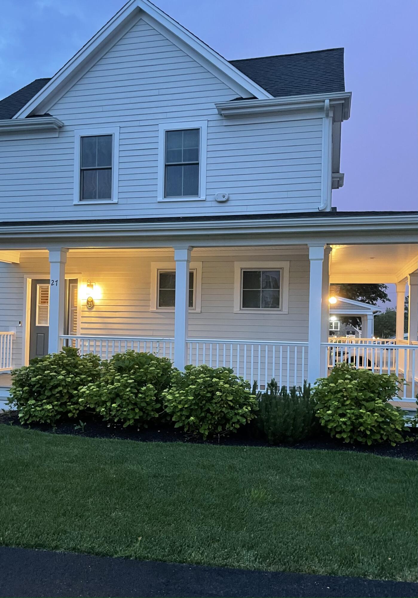 601 Ma Route, Unit 27 Dennis, MA 02638 - Photo 33 of 34 a view of a house with many windows and plants