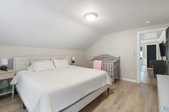 a bedroom with a bed and a view of bedroom