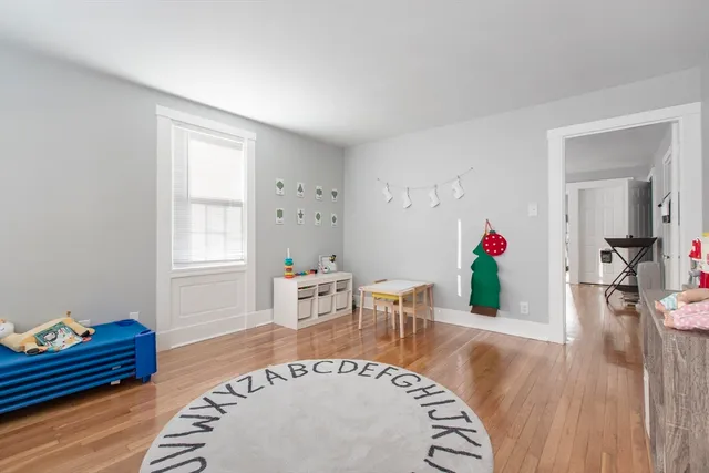 a living room with furniture and a table