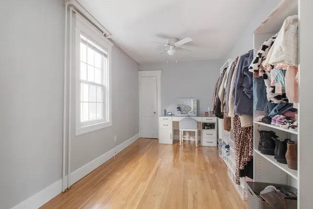 a view of a kitchen with fridge and workspace