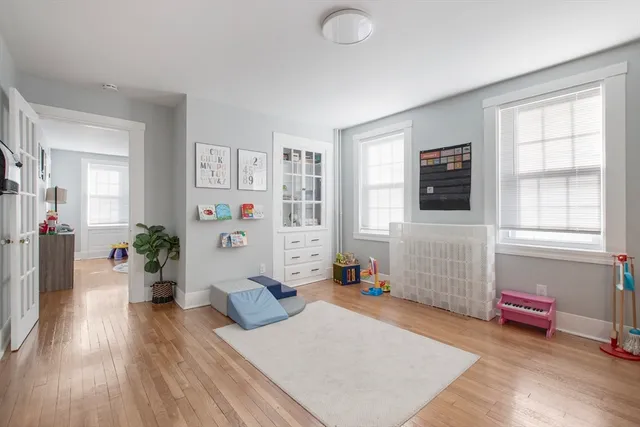 a living room with furniture and flat screen tv