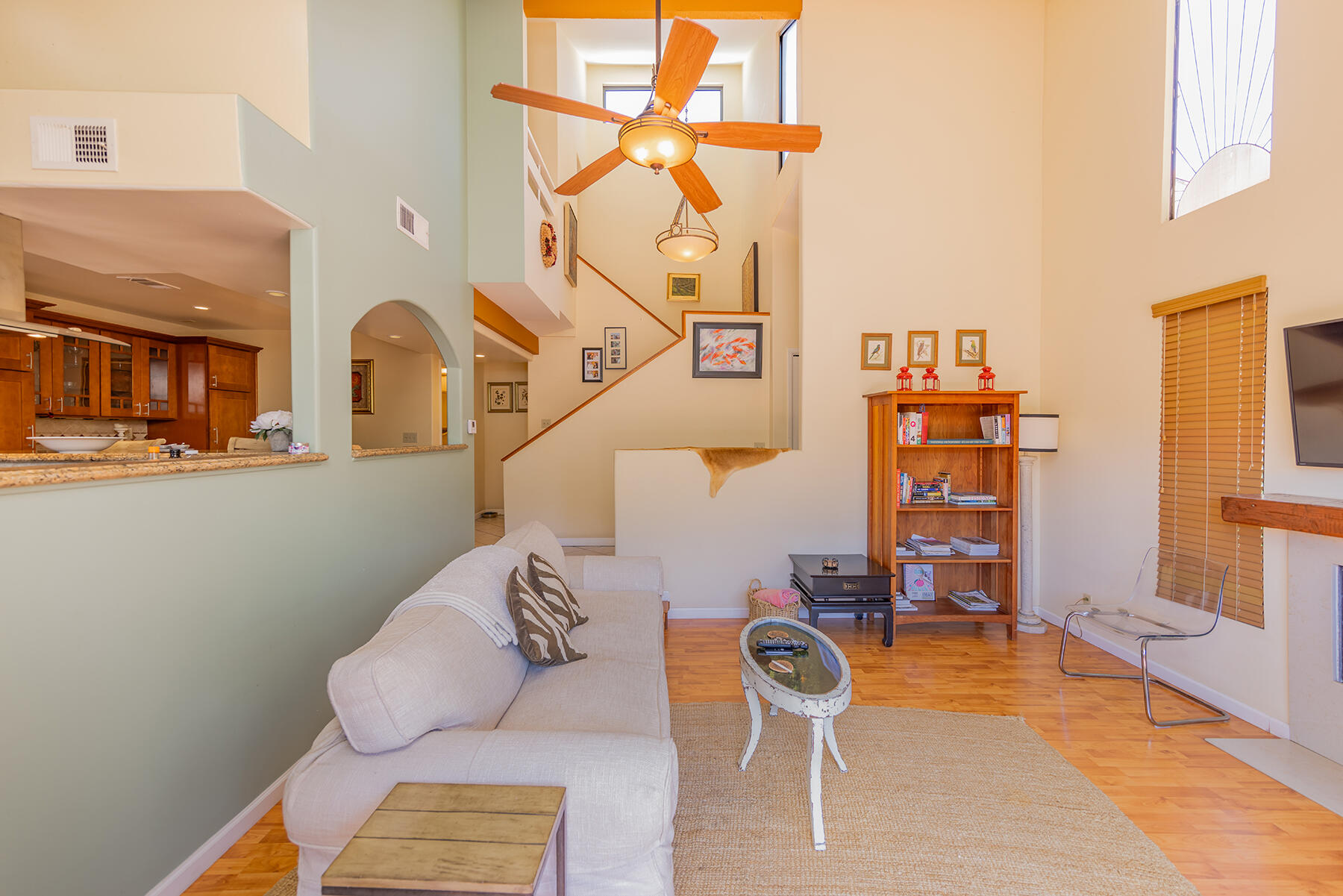 211 North Carrillo Road, Unit E Ojai, CA 93023 - Photo 1 of 27 a living room with furniture a rug and a chandelier