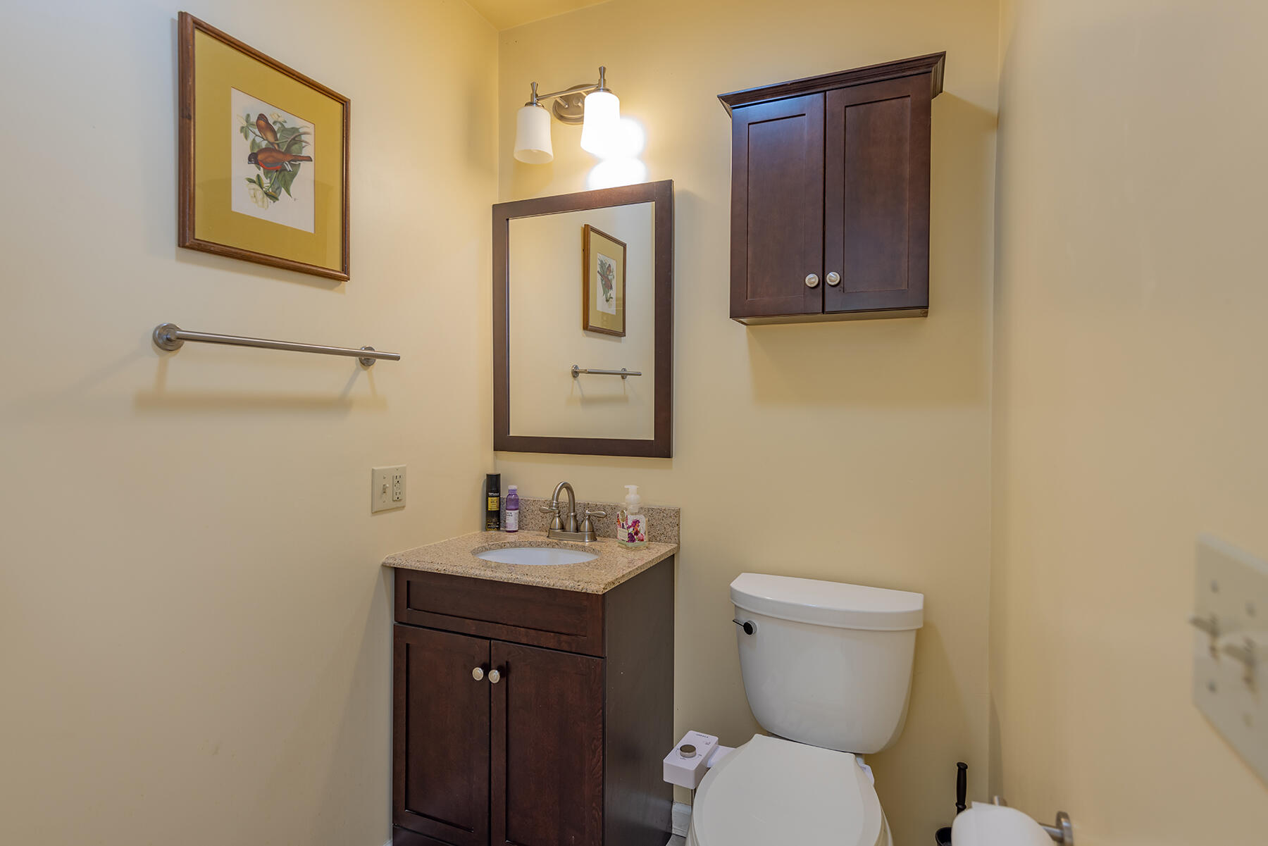 211 North Carrillo Road, Unit E Ojai, CA 93023 - Photo 12 of 27 a bathroom with a toilet sink and mirror