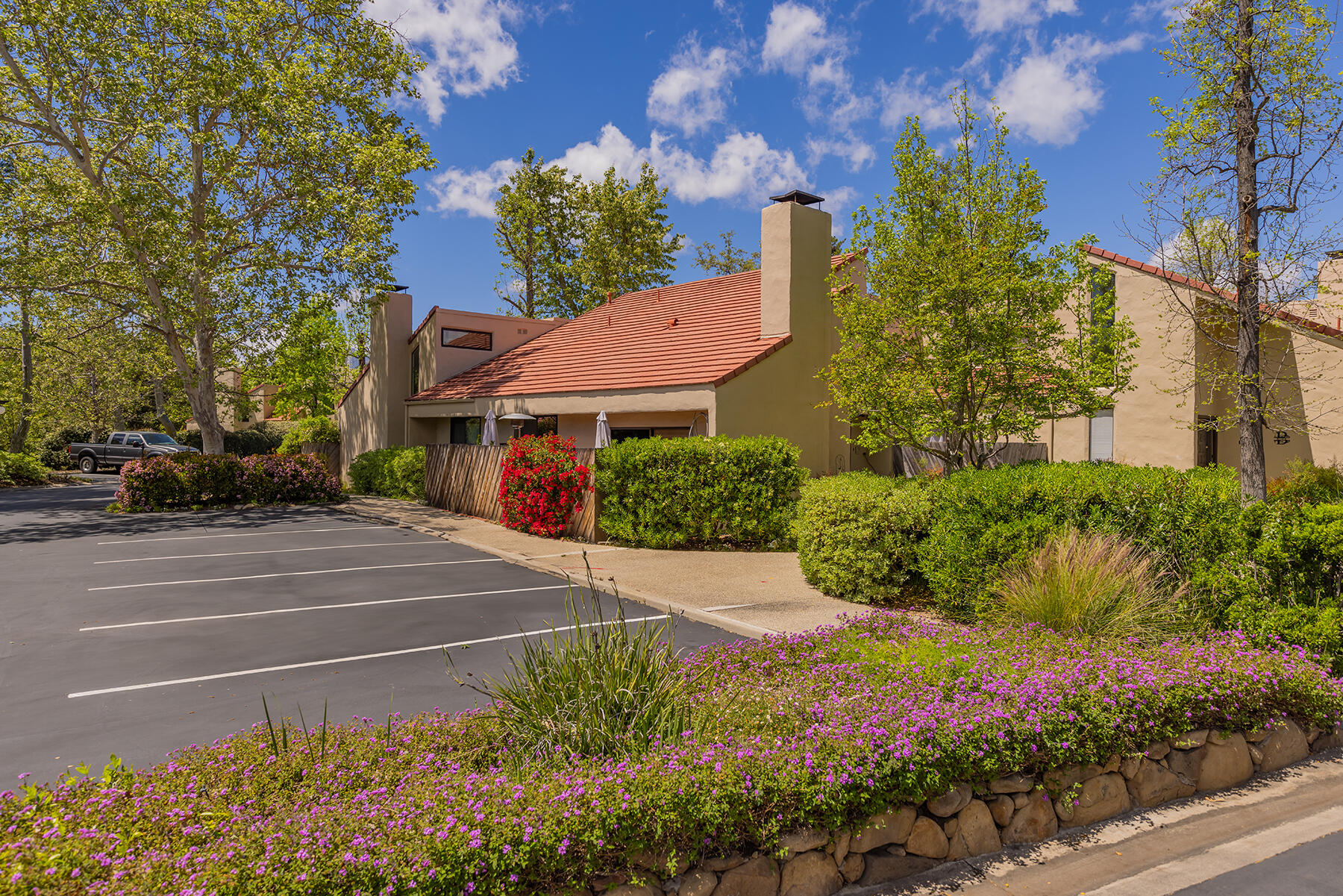 211 North Carrillo Road, Unit E Ojai, CA 93023 - Photo 18 of 27 a view of a house with a garden and pathway
