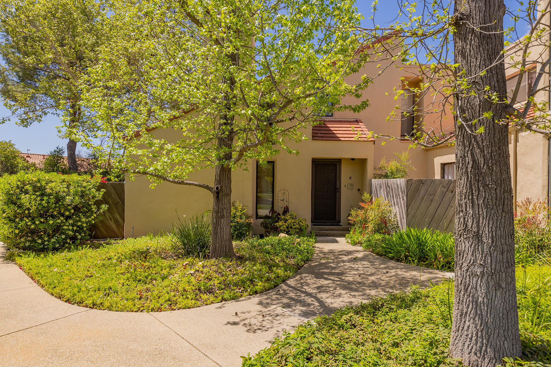 211 North Carrillo Road, Unit E Ojai, CA 93023 - Photo 22 of 27 front view of a house with a garden