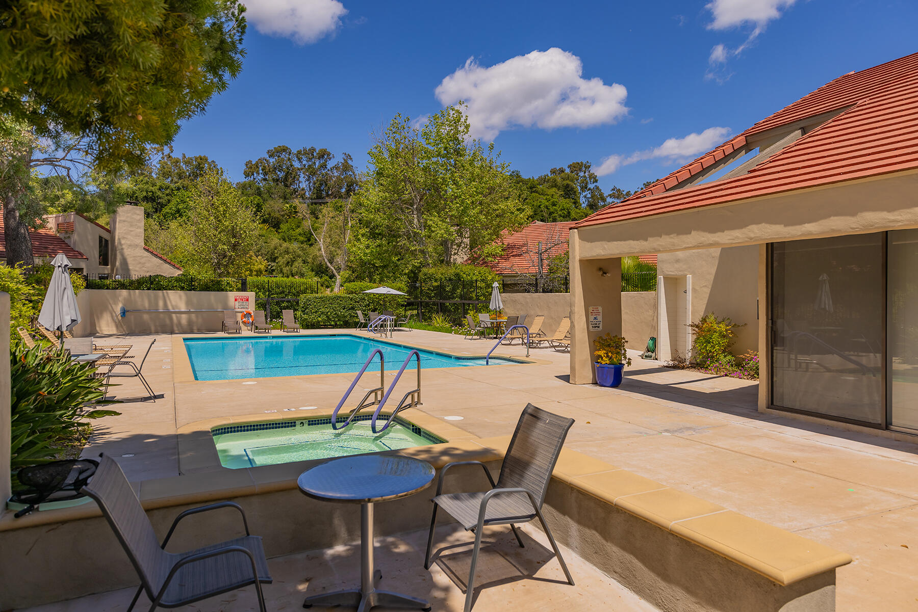211 North Carrillo Road, Unit E Ojai, CA 93023 - Photo 24 of 27 a view of a patio with table and chairs and potted plants