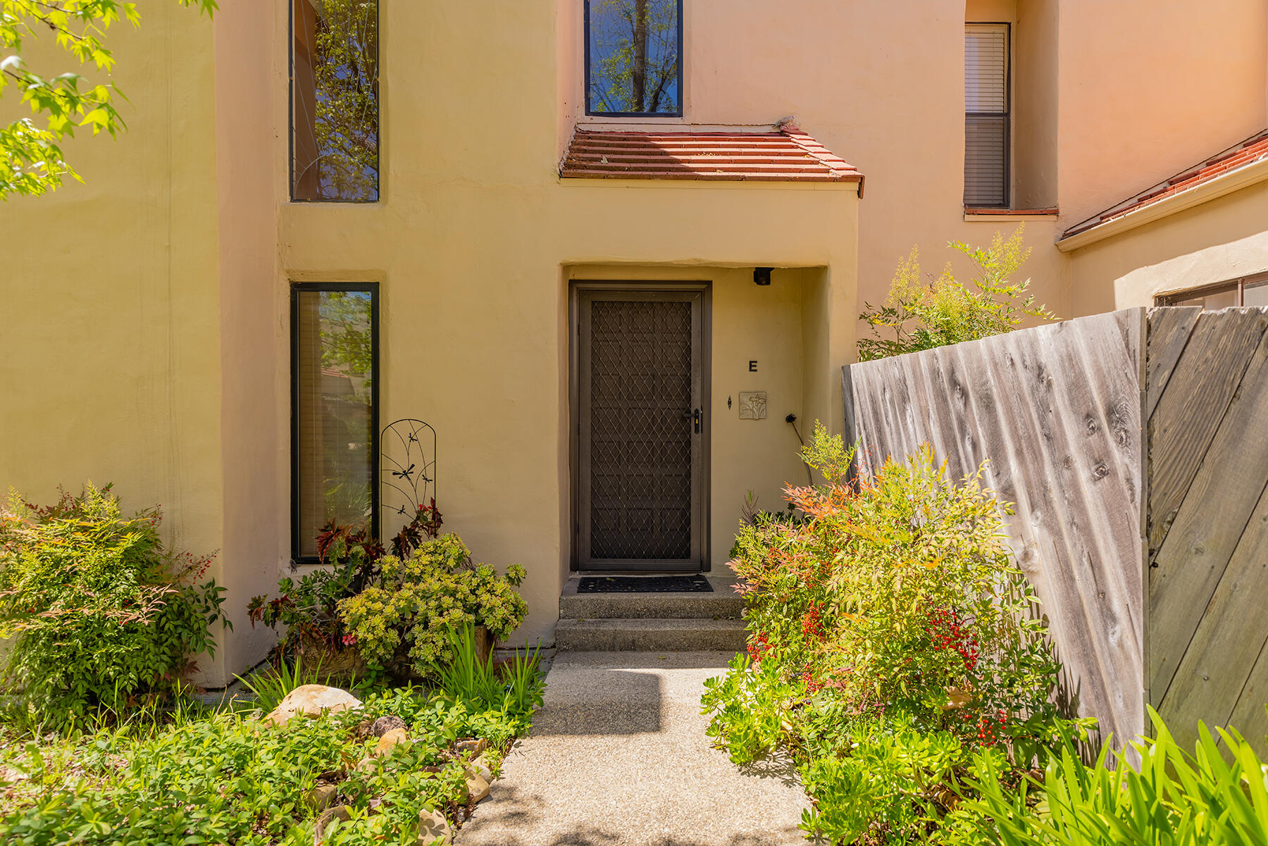 211 North Carrillo Road, Unit E Ojai, CA 93023 - Photo 3 of 27 a front view of a house with garden