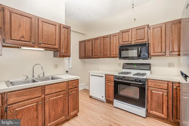 a white toilet sitting next to a white sink