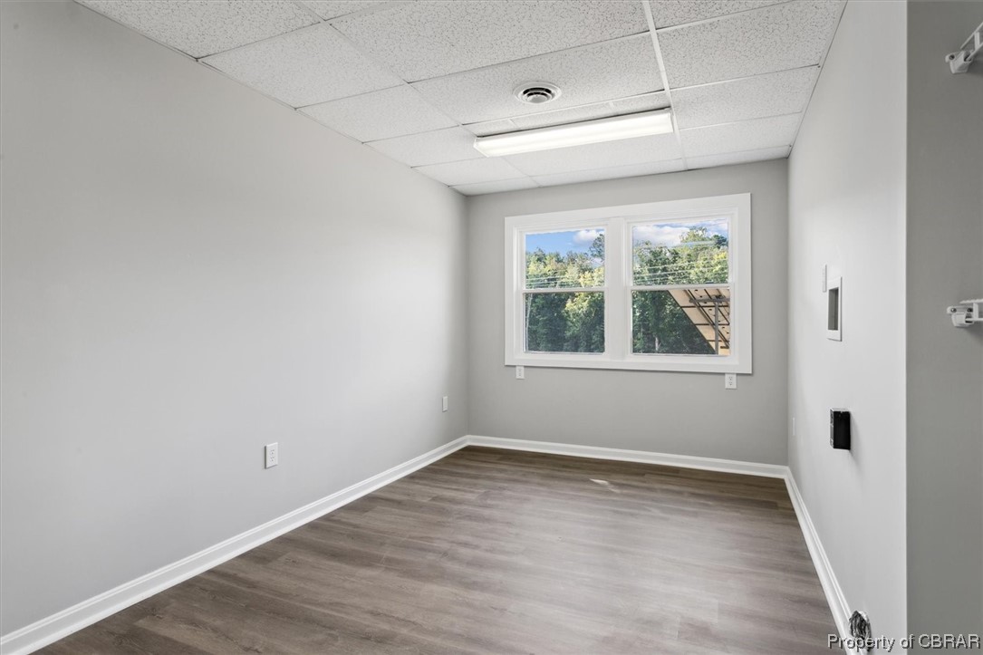 8636 Diascund Road Lanexa, VA 23089 - Photo 35 of 50 Unfurnished room featuring light hardwood flooring and a drop ceiling