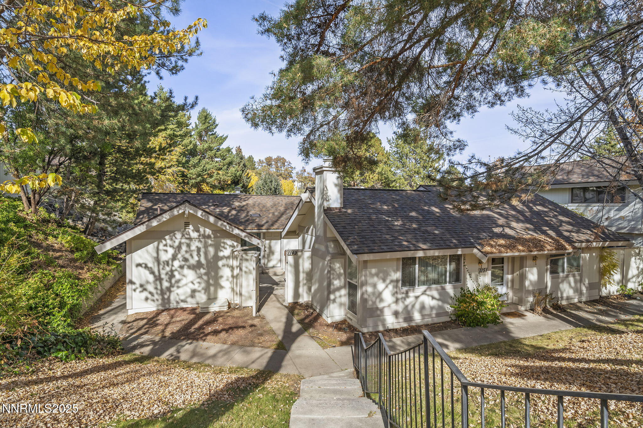 1149 Wagon Wheel Circle Reno, NV 89503 - Photo 1 of 19 a view of a house with a tree