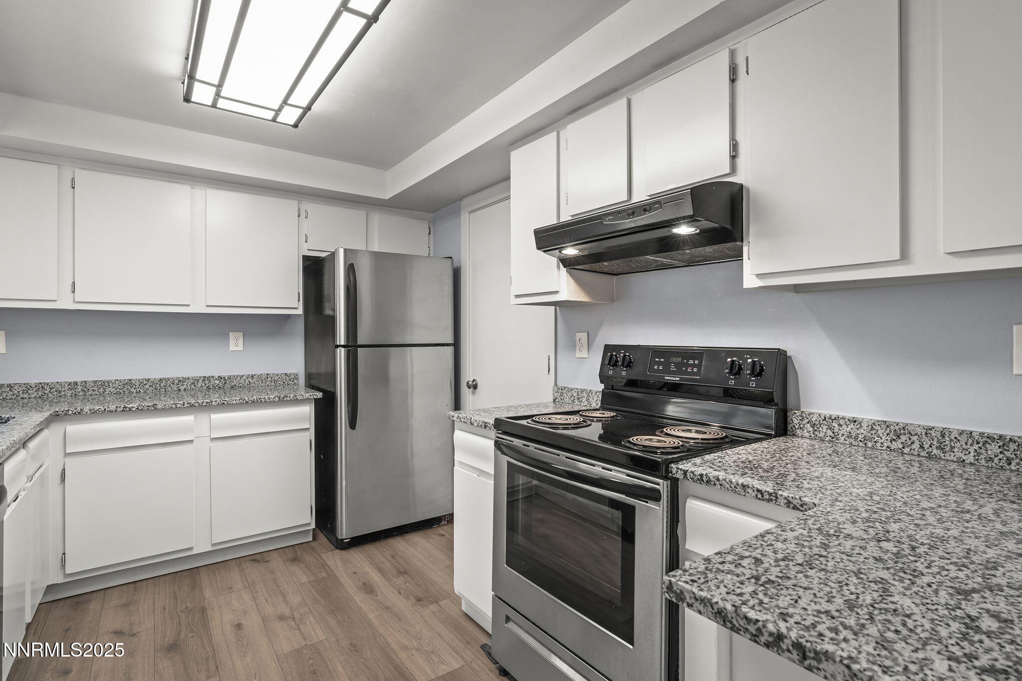 1149 Wagon Wheel Circle Reno, NV 89503 - Photo 8 of 19 a kitchen with stainless steel appliances granite countertop a refrigerator stove a sink and dishwasher