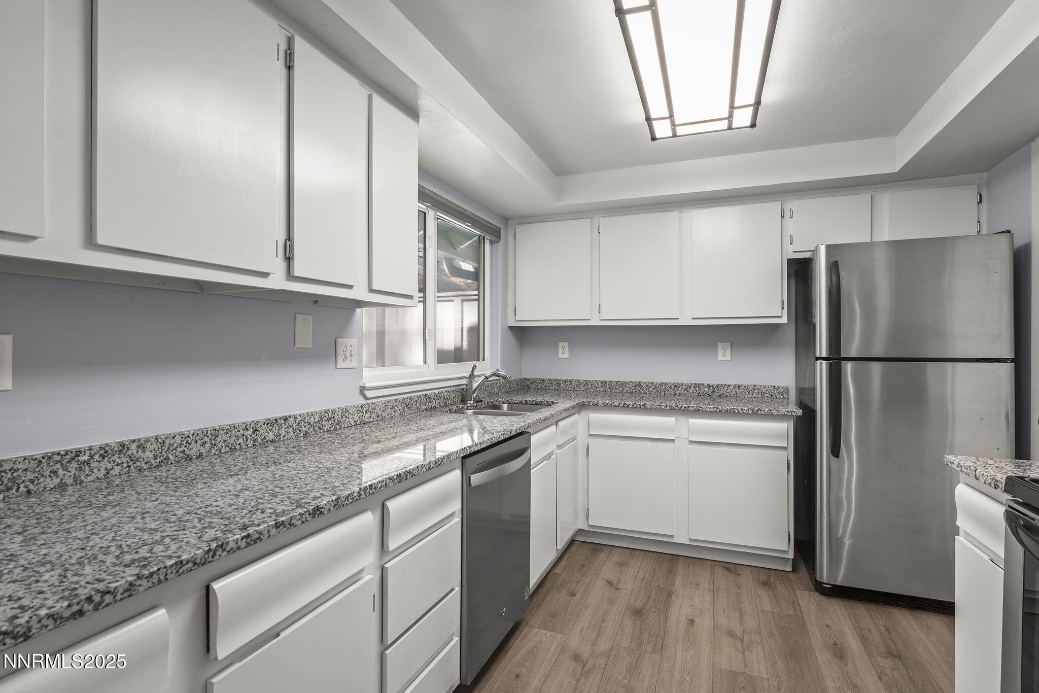 1149 Wagon Wheel Circle Reno, NV 89503 - Photo 9 of 19 a kitchen with a refrigerator sink and cabinets