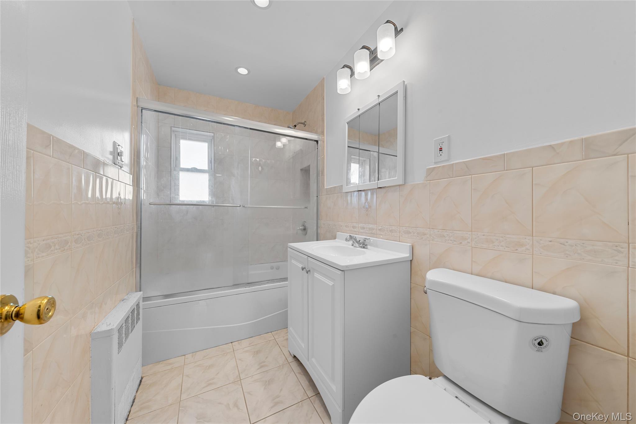 1331 Remsen Avenue Brooklyn, NY 11236 - Photo 20 of 30 a bathroom with a sink a toilet and shower