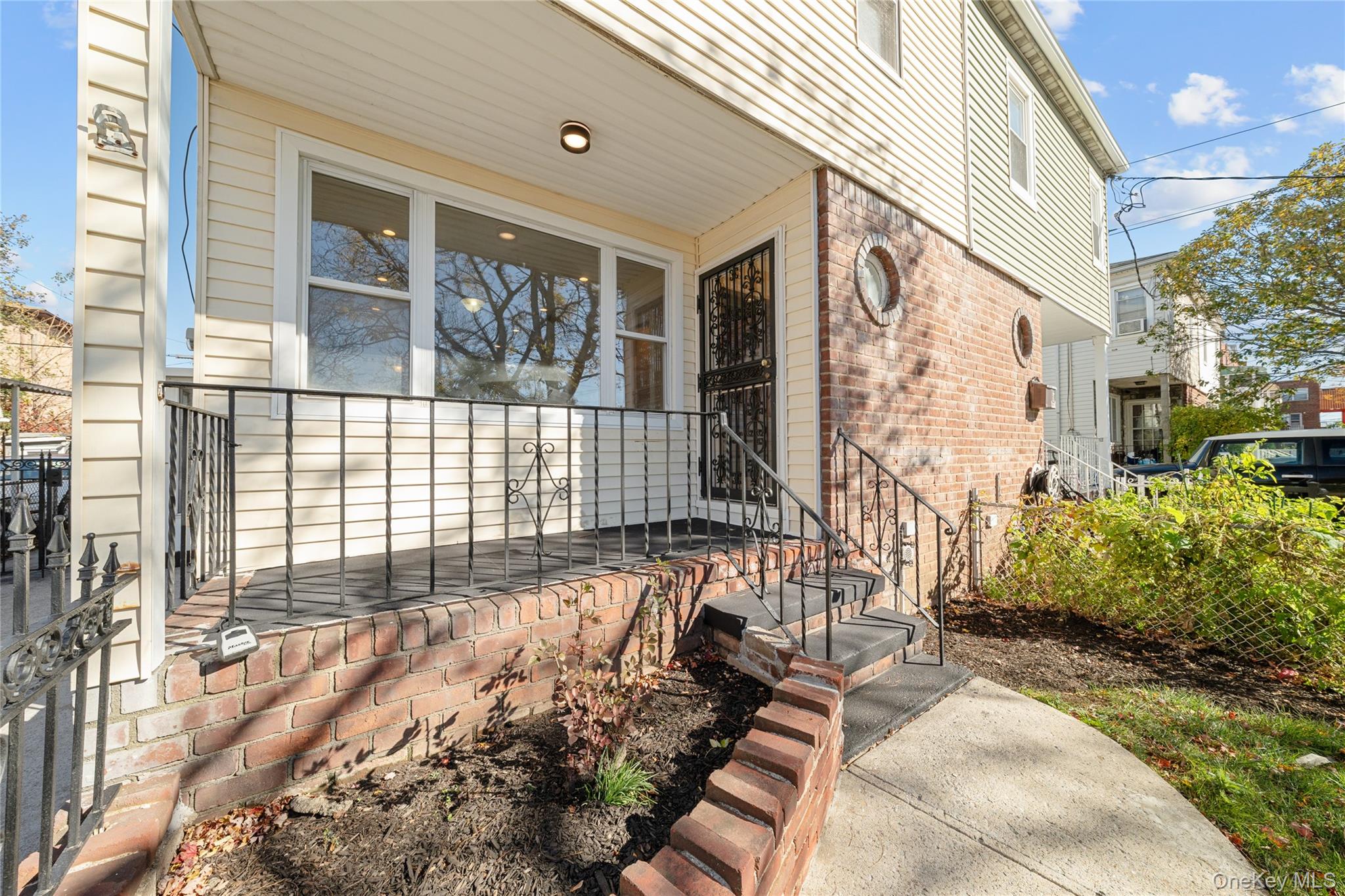 1331 Remsen Avenue Brooklyn, NY 11236 - Photo 25 of 30 a view of a patio with couches table and chairs and potted plants
