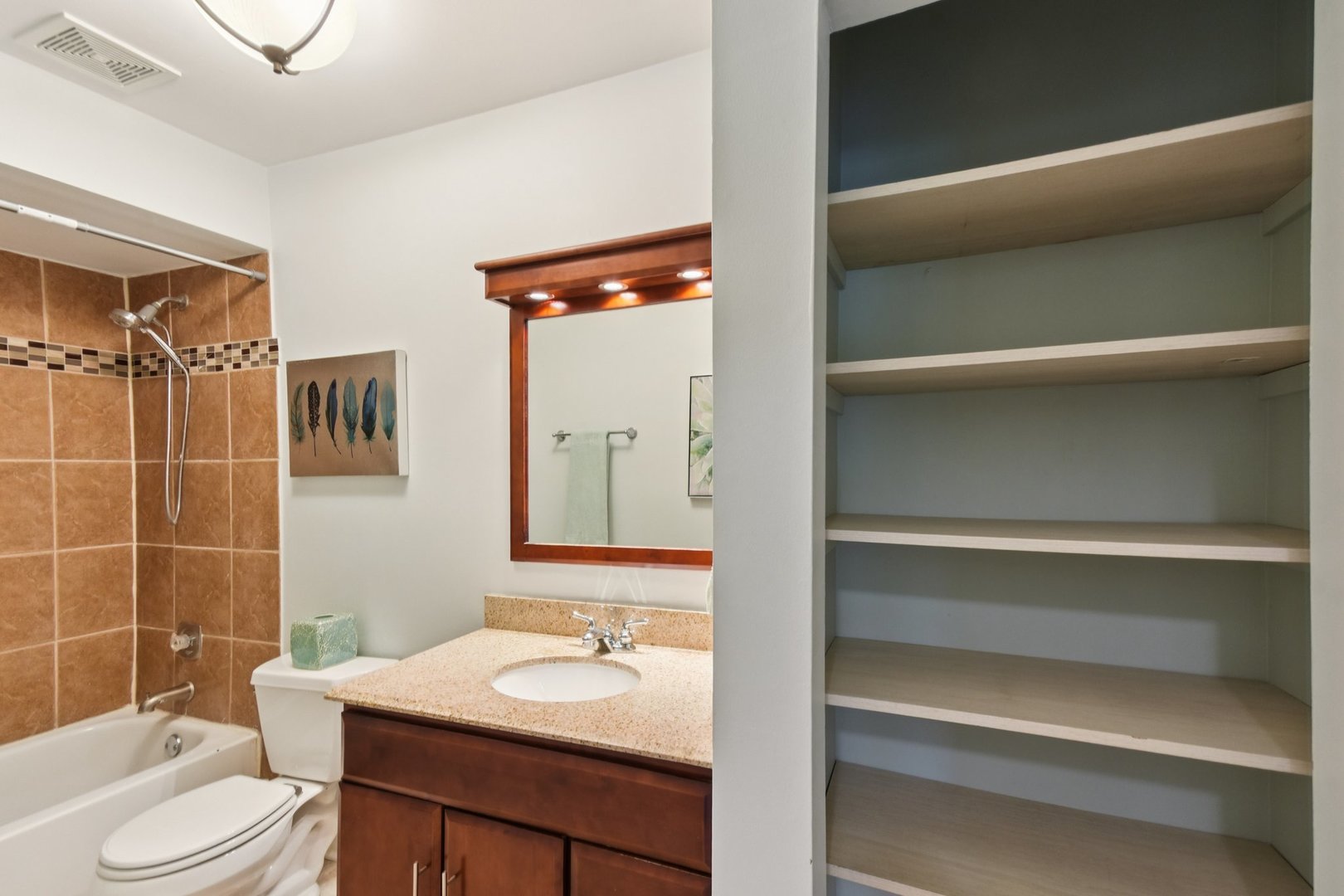 493 McHenry Road, Unit 1B Wheeling, IL 60090 - Photo 18 of 30 a bathroom with a sink a toilet and shower