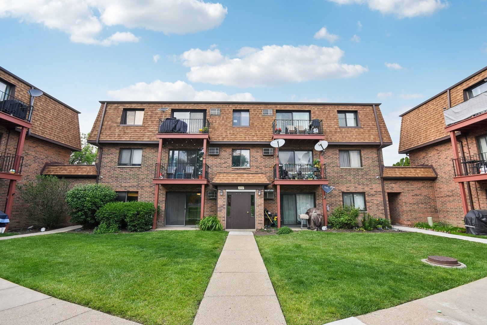 493 McHenry Road, Unit 1B Wheeling, IL 60090 - Photo 22 of 30 front view of a brick building