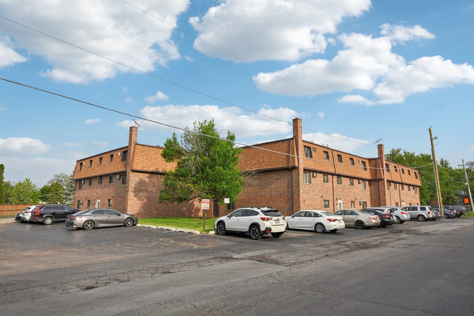 493 McHenry Road, Unit 1B Wheeling, IL 60090 - Photo 25 of 30 a car parked in front of a house
