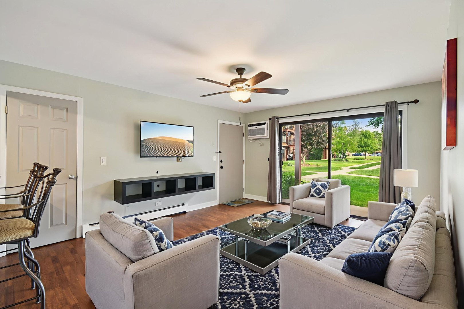 493 McHenry Road, Unit 1B Wheeling, IL 60090 - Photo 3 of 30 a living room with furniture and a large window