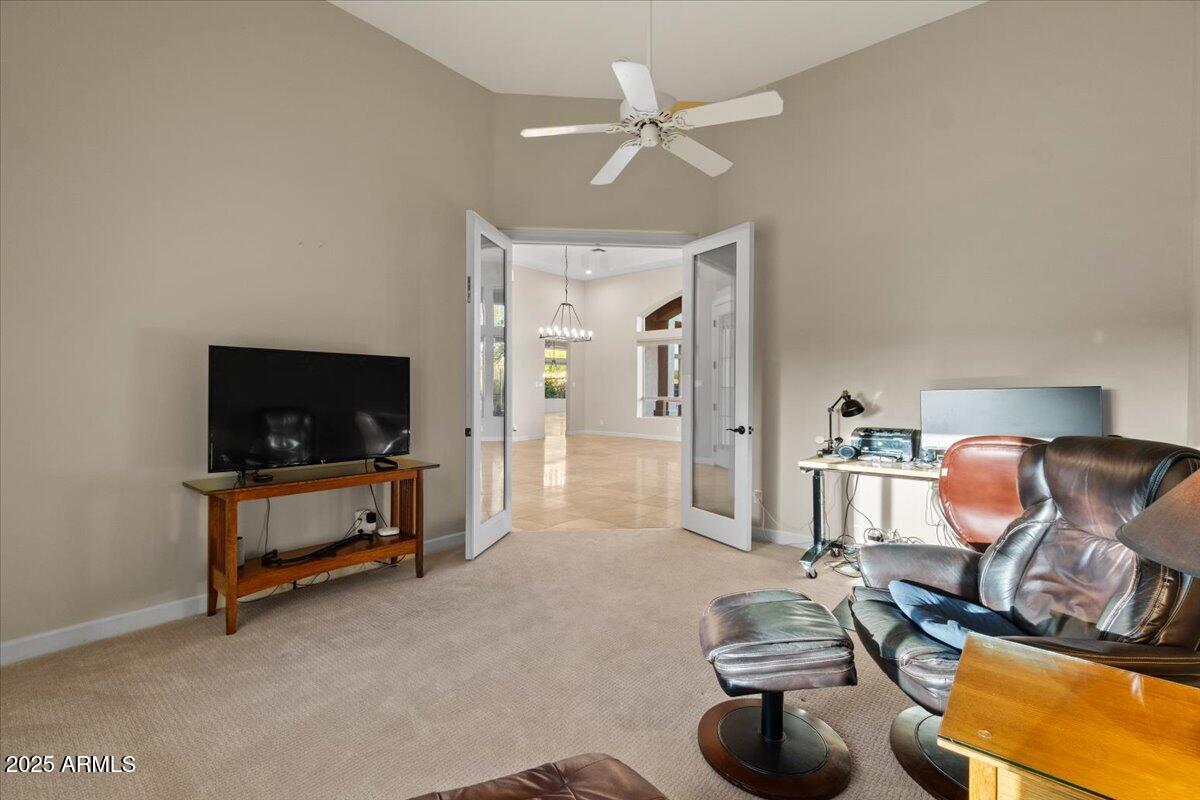 8540 East McDowell Road, Unit 119 Mesa, AZ 85207 - Photo 16 of 94 a living room with furniture and a flat screen tv