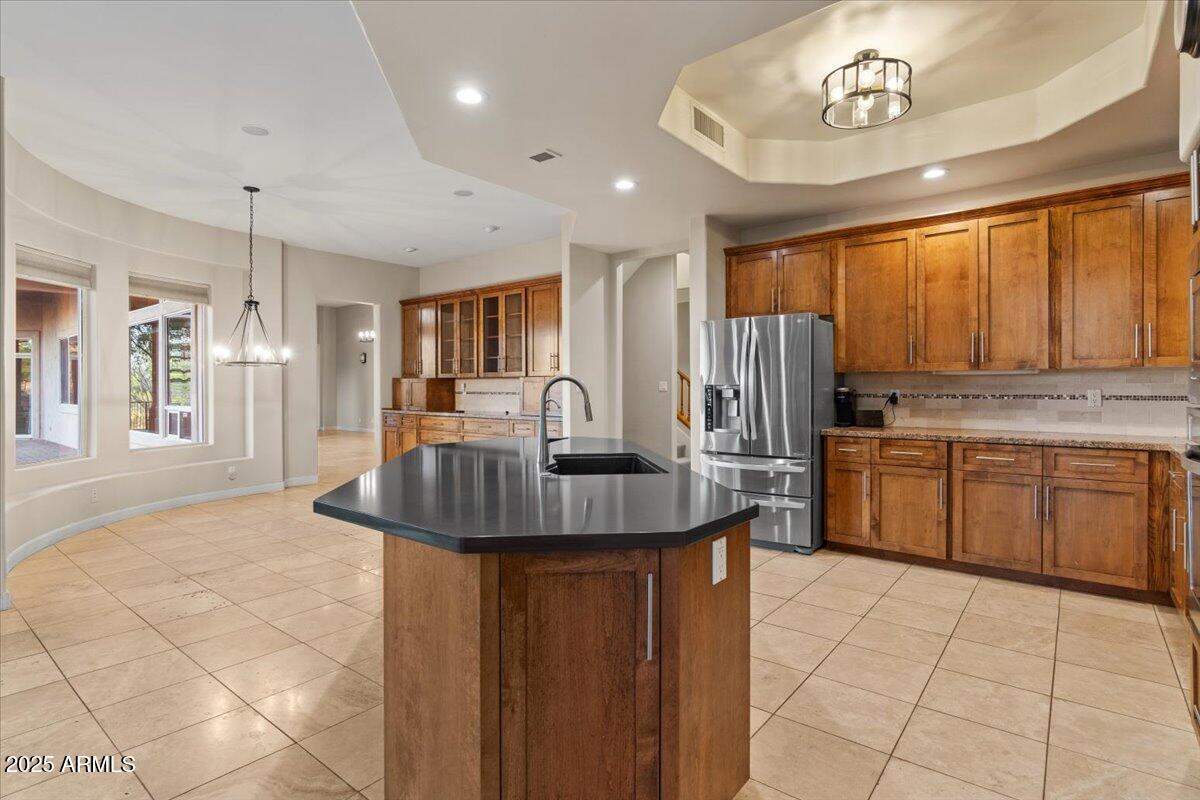 8540 East McDowell Road, Unit 119 Mesa, AZ 85207 - Photo 24 of 94 a kitchen with stainless steel appliances granite countertop a sink a stove and a refrigerator