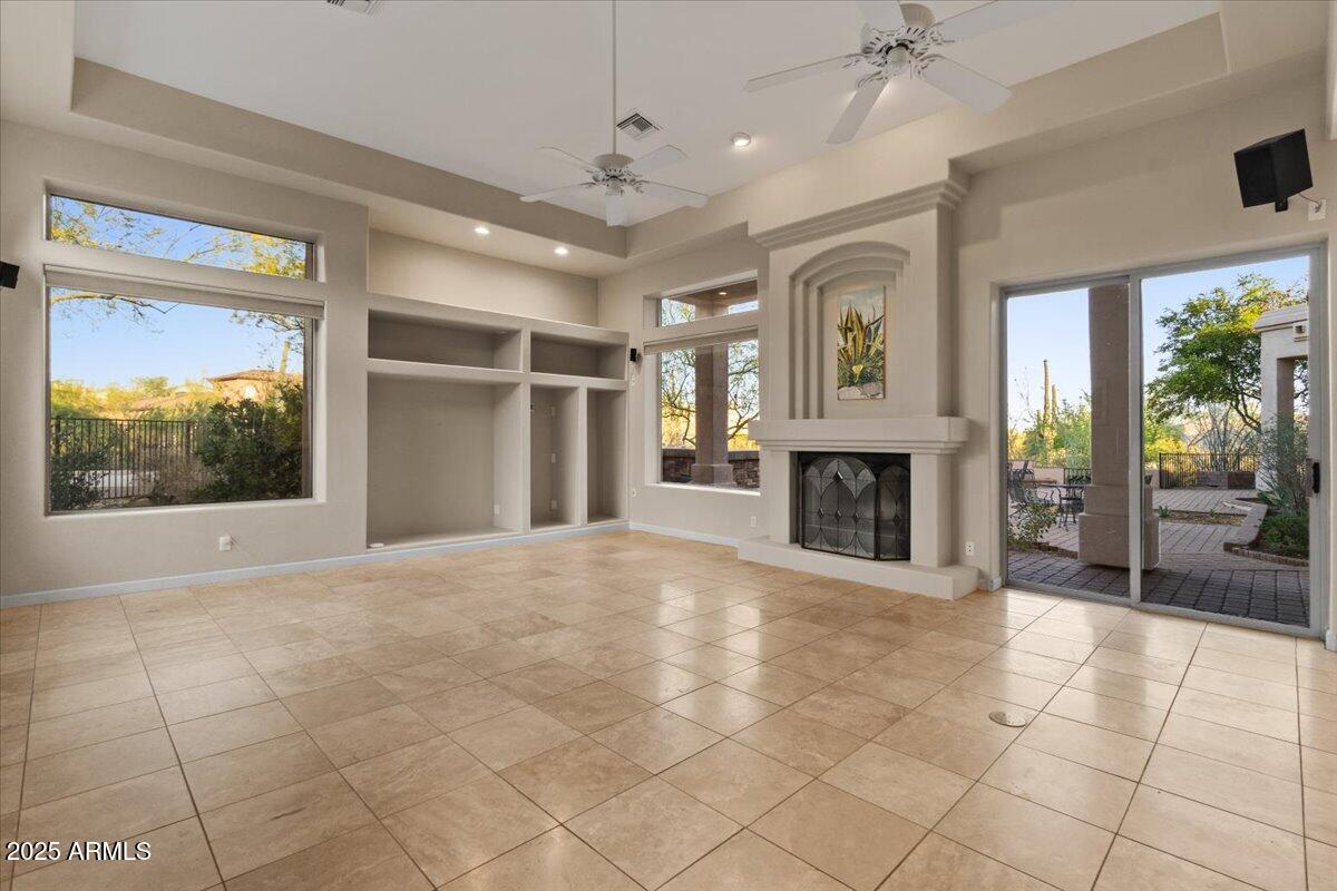 8540 East McDowell Road, Unit 119 Mesa, AZ 85207 - Photo 28 of 94 a view of an empty room with a fireplace and a window