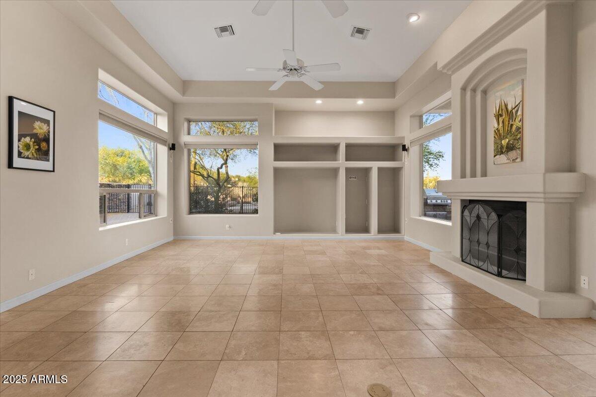 8540 East McDowell Road, Unit 119 Mesa, AZ 85207 - Photo 29 of 94 a view of an empty room with a window and fireplace