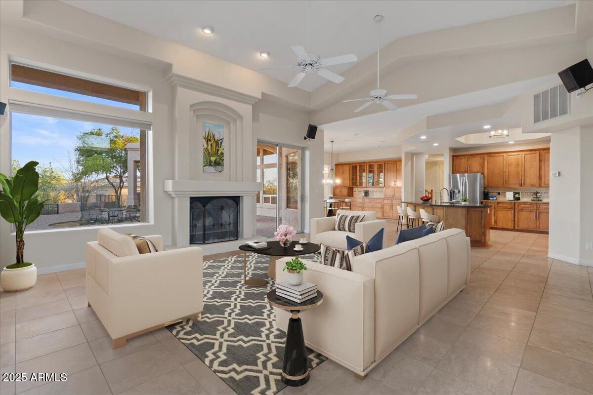 8540 East McDowell Road, Unit 119 Mesa, AZ 85207 - Photo 2 of 94 a living room with fireplace furniture and a large window