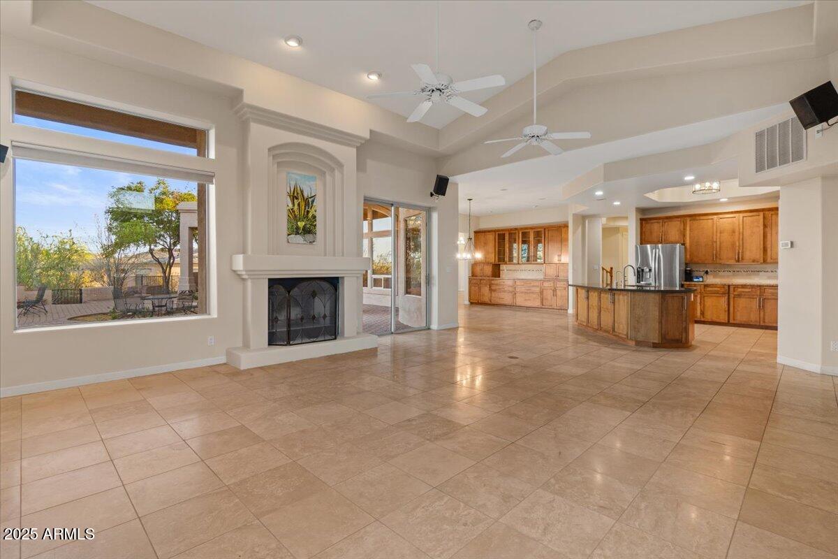 8540 East McDowell Road, Unit 119 Mesa, AZ 85207 - Photo 30 of 94 a view of a kitchen with furniture and a fireplace