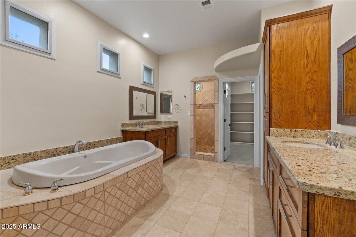 8540 East McDowell Road, Unit 119 Mesa, AZ 85207 - Photo 36 of 94 a bathroom with a sink toilet and shower