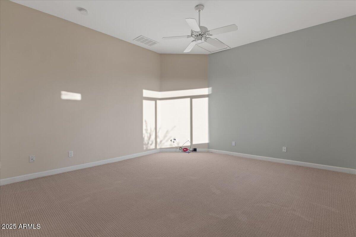 8540 East McDowell Road, Unit 119 Mesa, AZ 85207 - Photo 42 of 94 a view of an empty room with a window