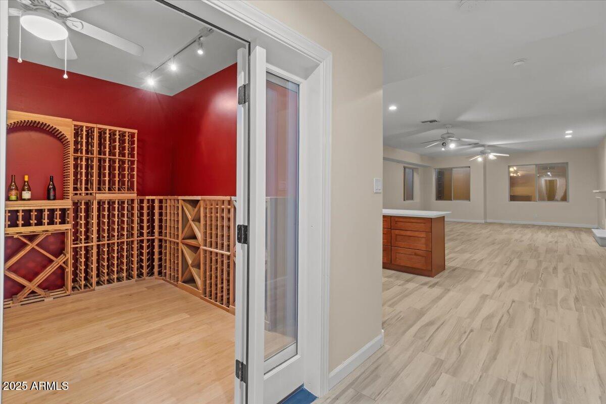 8540 East McDowell Road, Unit 119 Mesa, AZ 85207 - Photo 52 of 94 a view of a hallway with wooden floor