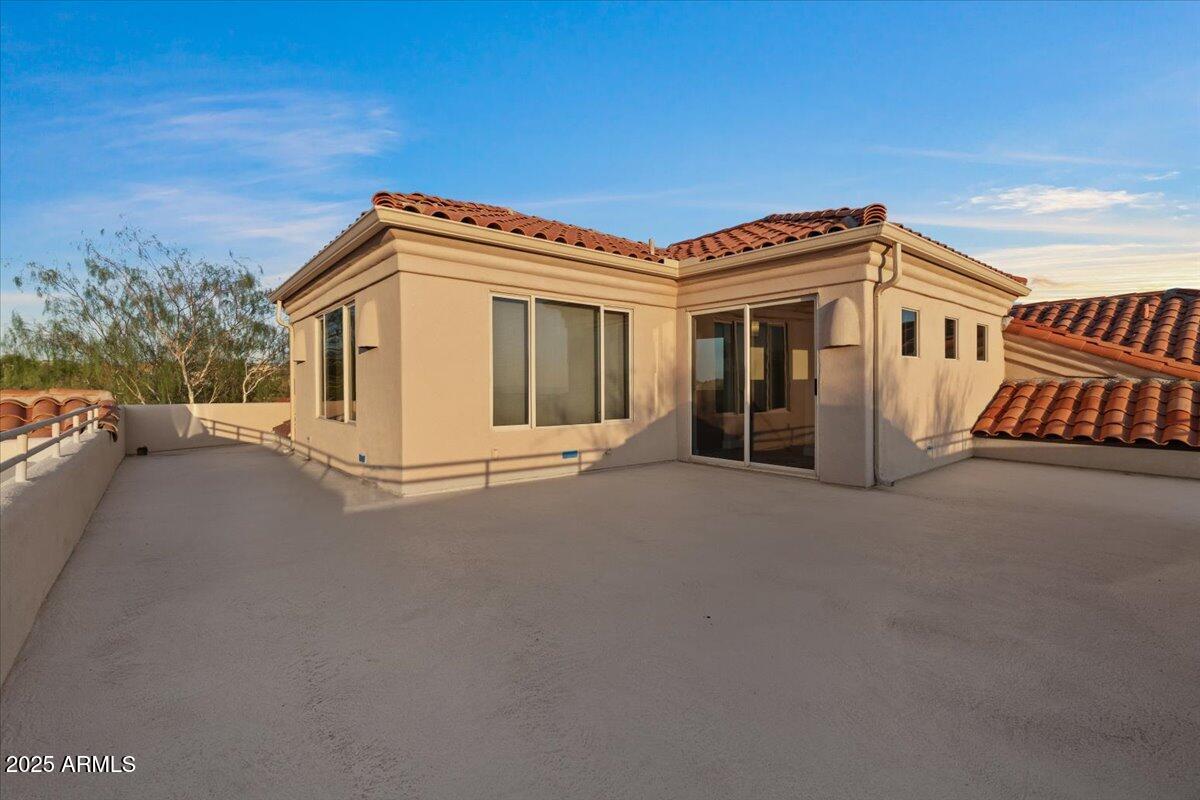 8540 East McDowell Road, Unit 119 Mesa, AZ 85207 - Photo 70 of 94 a view of a house with a roof deck