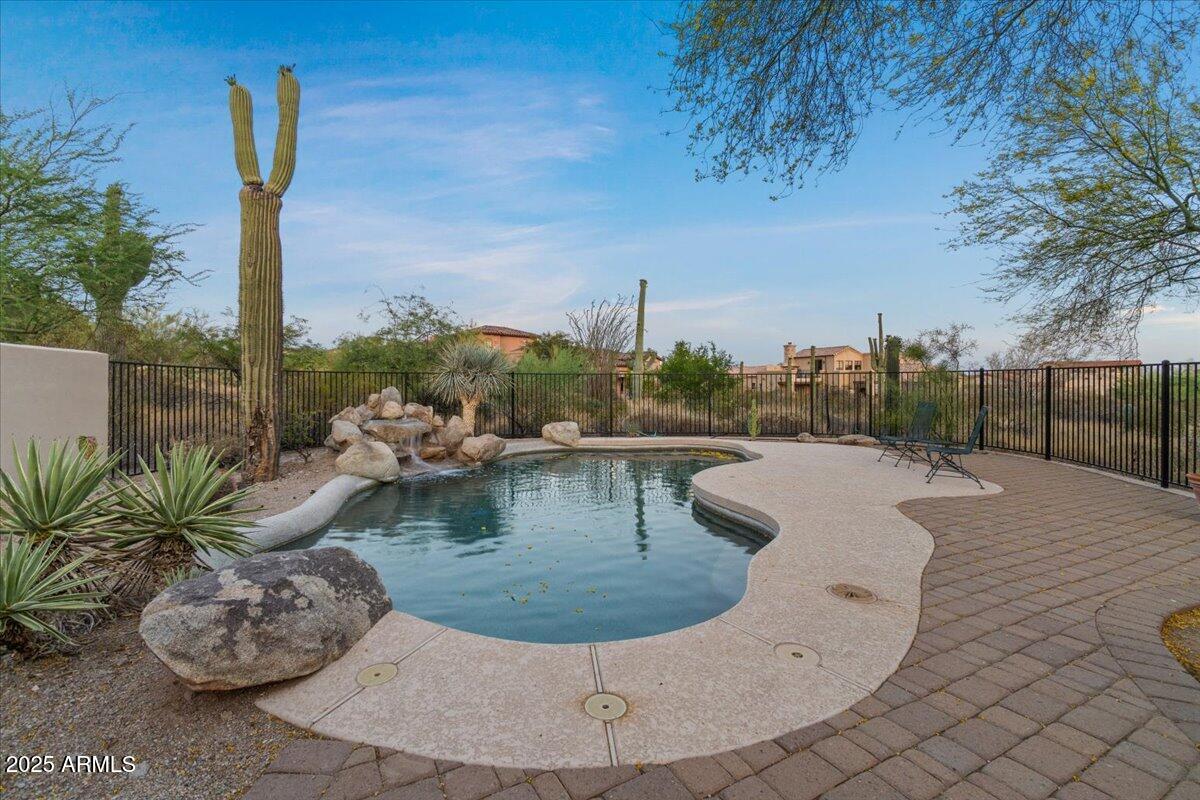 8540 East McDowell Road, Unit 119 Mesa, AZ 85207 - Photo 79 of 94 a view of a swimming pool with a terrace