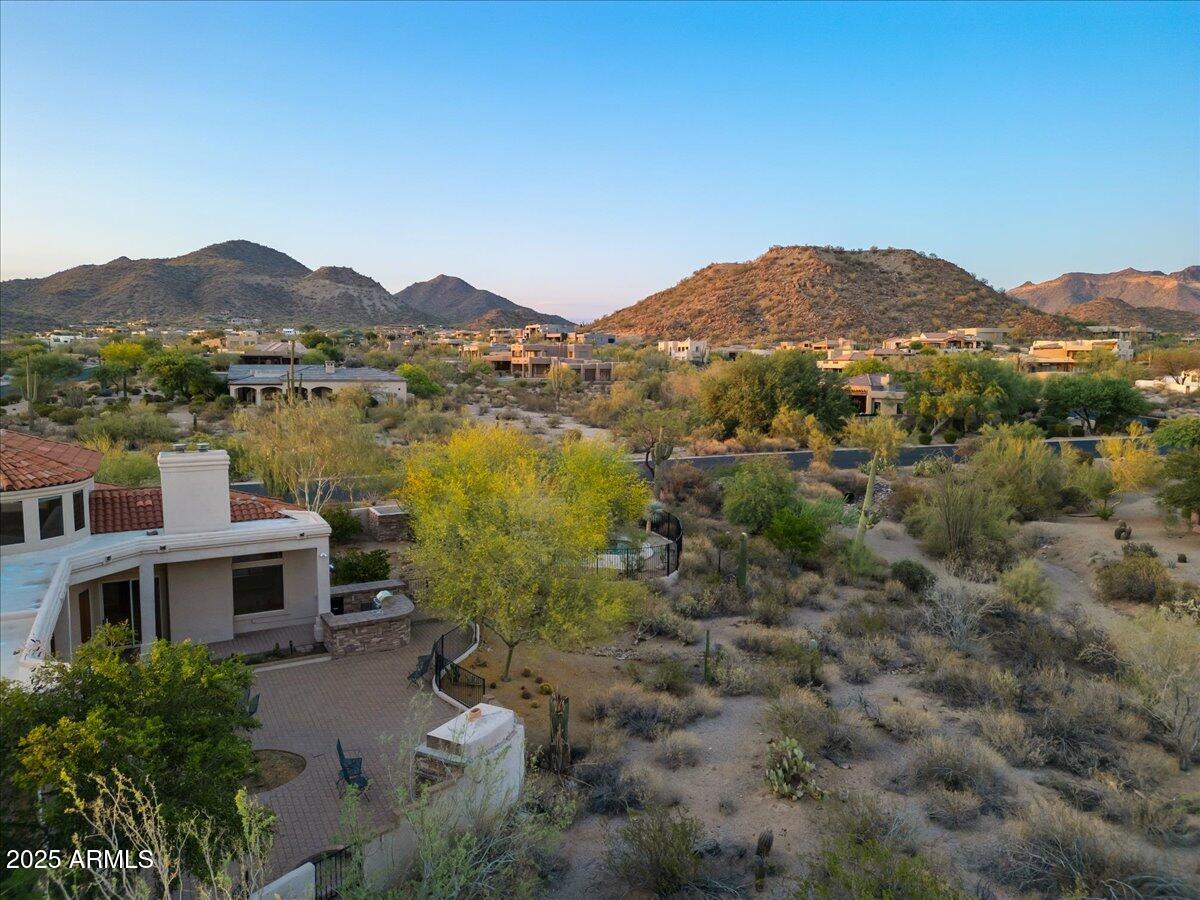 8540 East McDowell Road, Unit 119 Mesa, AZ 85207 - Photo 84 of 94 a view of a lake with a mountain in the background