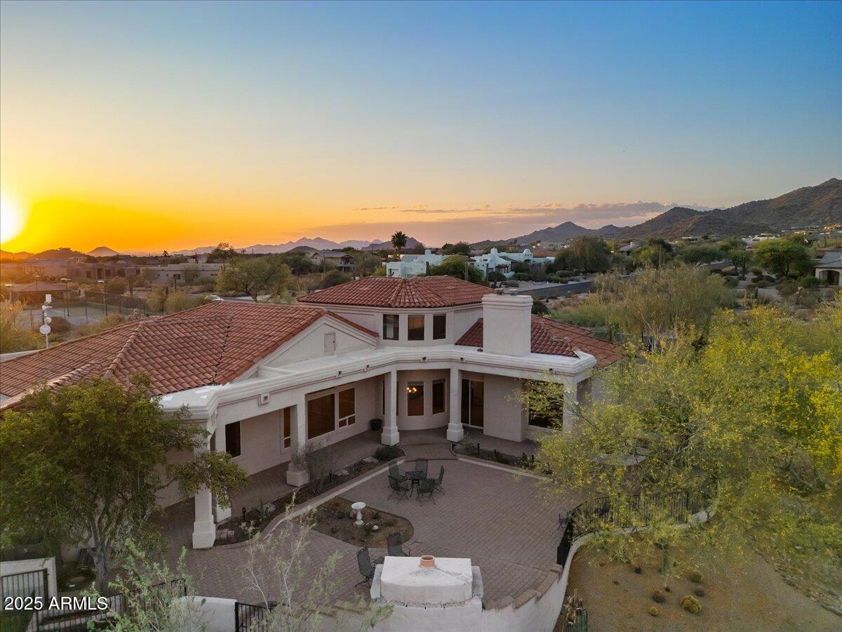 8540 East McDowell Road, Unit 119 Mesa, AZ 85207 - Photo 87 of 94 an aerial view of a house with a big yard