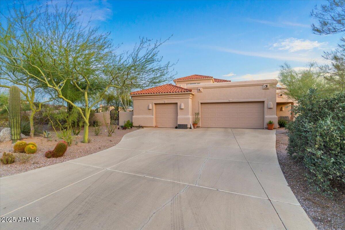 8540 East McDowell Road, Unit 119 Mesa, AZ 85207 - Photo 8 of 94 a front view of a house with a garden