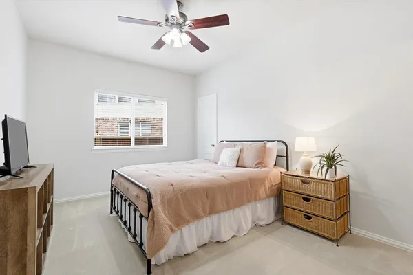 a room with a sink cabinets and a mirror