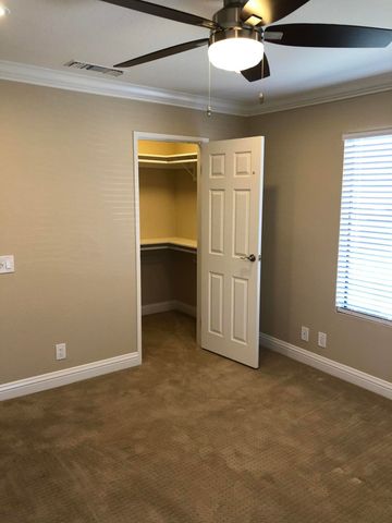 a bathroom with a shower and a glass door