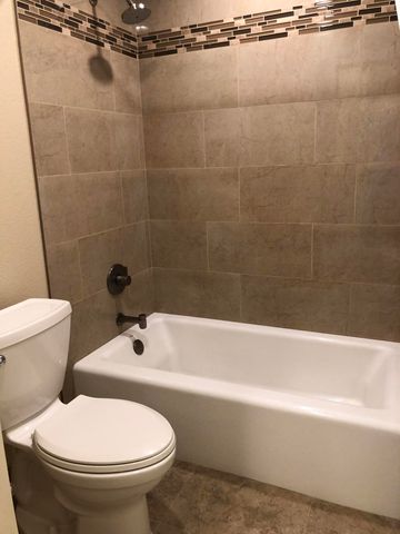 a view of a chairs and table in patio